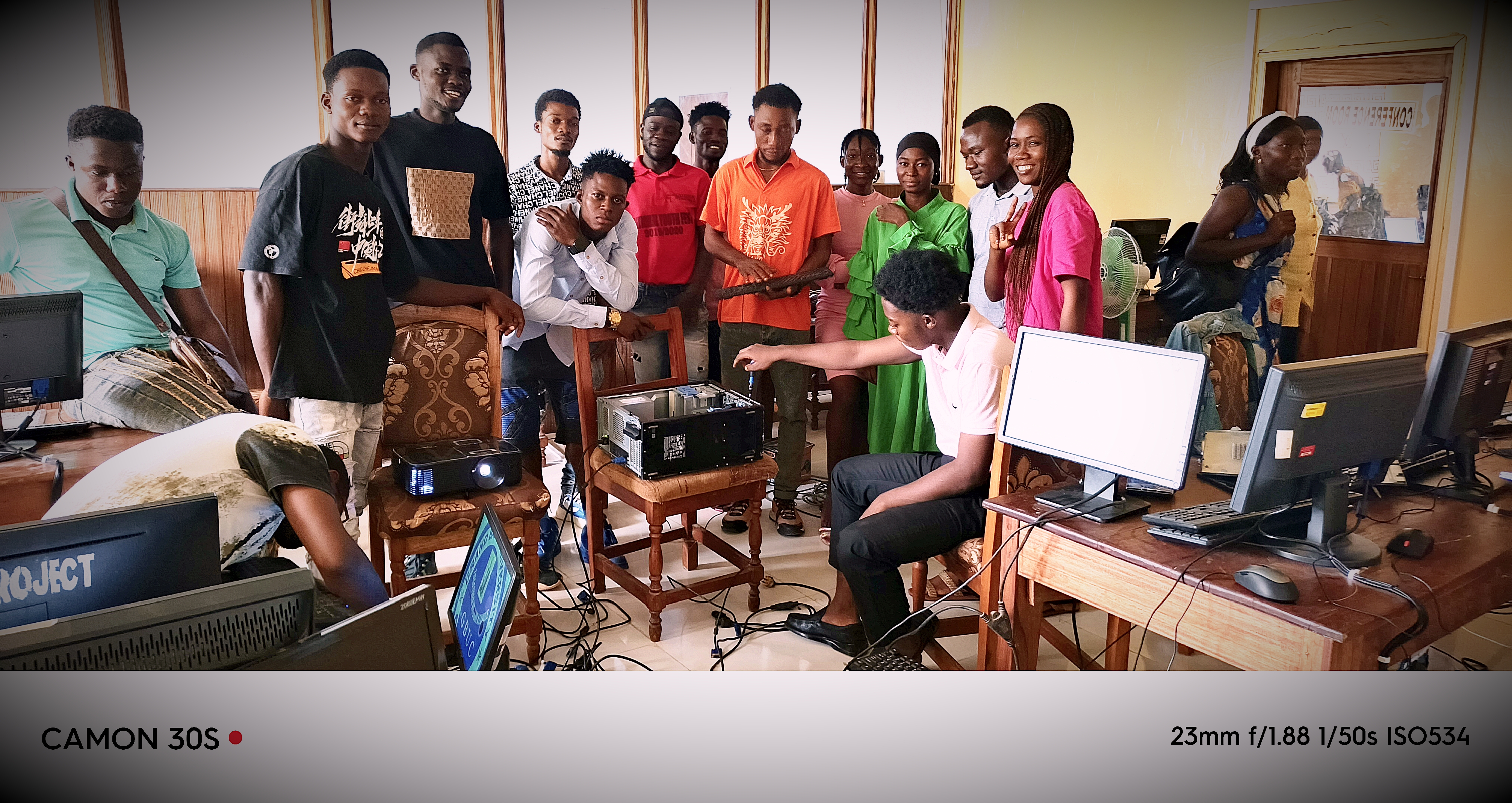 Nathan R. Watalah with classmates during computer hardware practical class in Liberia